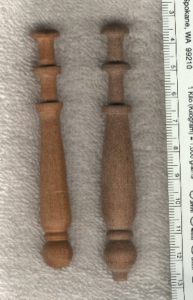 two wooden bobbins after the style of England's Oldest Bobbin